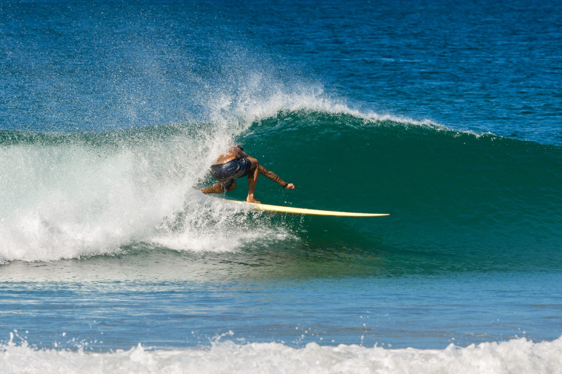 Surfing near Playa Avellanas
